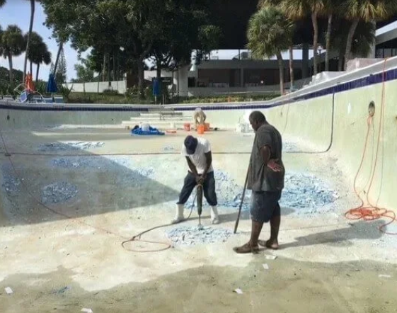 Commercial pool before renovation with its old surface removed