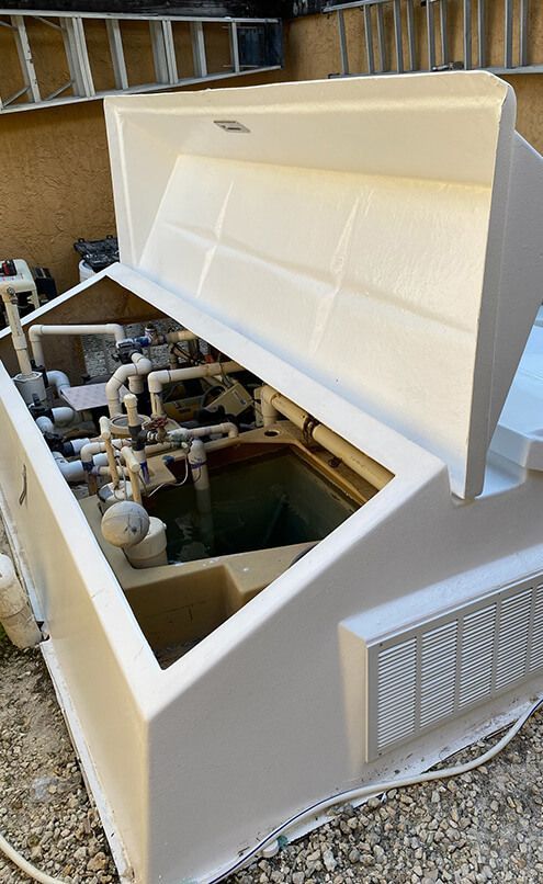 Technician restoring an aging fiberglass Vak-Pak equipment vault